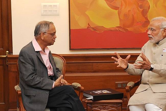 N R Narayana Murthy as seen sitting with Prime Minister Narendra Modi in December 2014