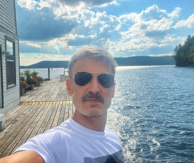 Rahul Dev taking a selfie at Carling Bay, Ontario in August 2022