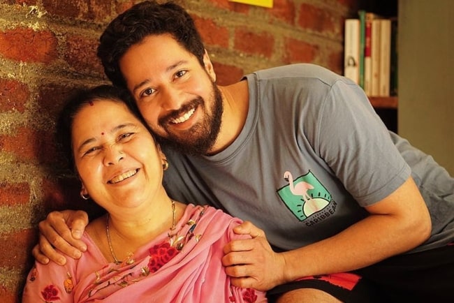 Rajat Barmecha smiling in a picture with his mother in August 2022