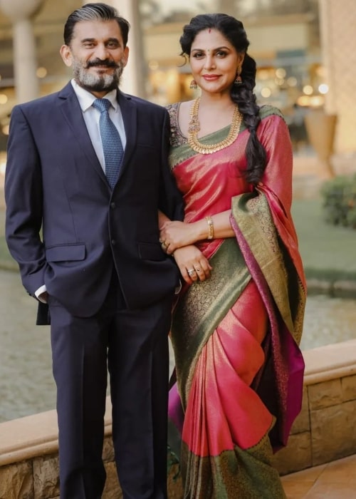 Asha Sharath as seen in a picture with her husband Sharath Varier in April 2023