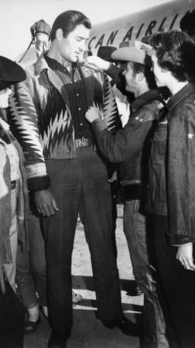Clint Walker as seen while being pinned with a Sheriff's Badge at Frontier Fiesta at the University of Houston (circa 1950s)