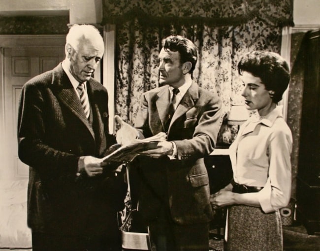 From Left to Right - Alastair Sim, John Mills, and Yvonne Mitchell as seen in a still from the film 'Escapade' (1955)