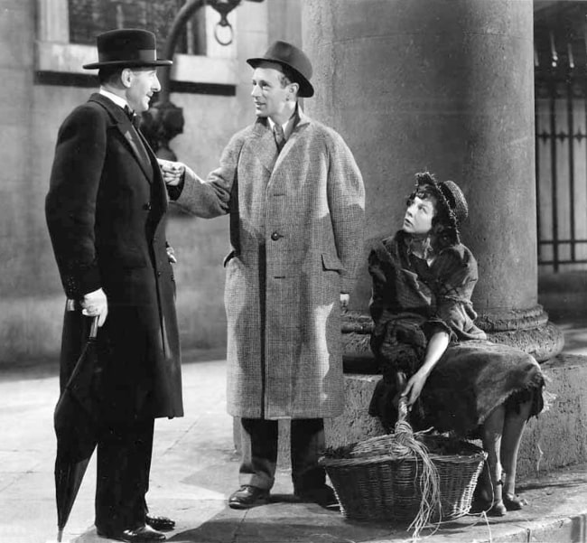 From Left to Right - Scott Sunderland, Leslie Howard, and Wendy Hiller as seen in a promotional still from the 1938 film 'Pygmalion', published in National Board of Review Magazine