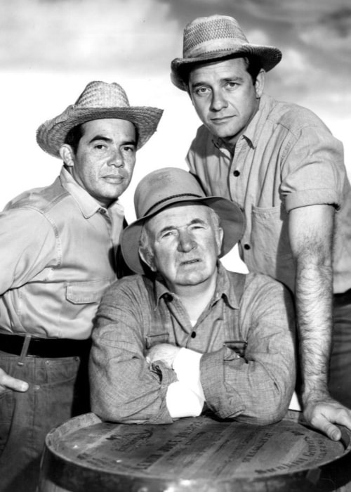 Photo from the television program The Real McCoys. Standing, from left Anthony Martinez (Pepino) and Richard Crenna (Luke McCoy). Seated Walter Brennan (Grandpa Amos McCoy) in August 1962