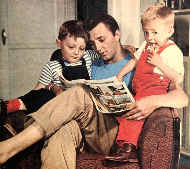 Robert Mitchum pictured at home reading with his two sons, James Mitchum (Left) and Christopher Mitchum (Right) in 1946
