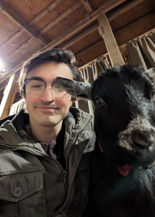 SmallAnt as seen in a selfie with a goat that was taken in January 2023