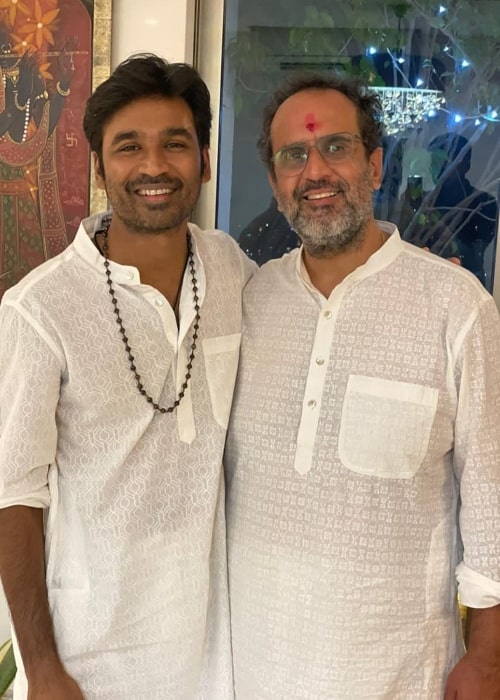 Anand L. Rai (Right) smiling for a picture with Dhanush in November 2020
