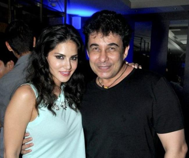Deepak Tijori as seen posing for a picture with Sunny Leone in November 2014