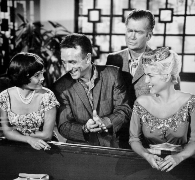 From Left to Right - Christine Moore, Dane Clark, Buddy Ebsen, and Jane Burgess as seen in an episode titled 'The Prime Mover' of 'The Twilight Zone' in 1961