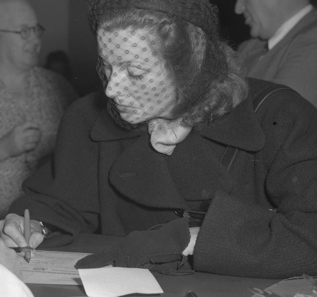 Greta Garbo as seen while signing her U.S. citizenship papers in February 1951