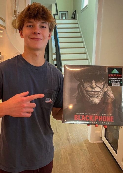 Jacob Moran as seen in a picture holding The Black Phone record in October 2022