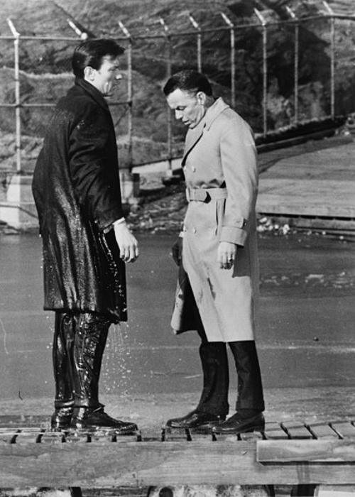 Laurence Harvey (left) and Frank Sinatra (right) filming a scene from The Manchurian Candidate
