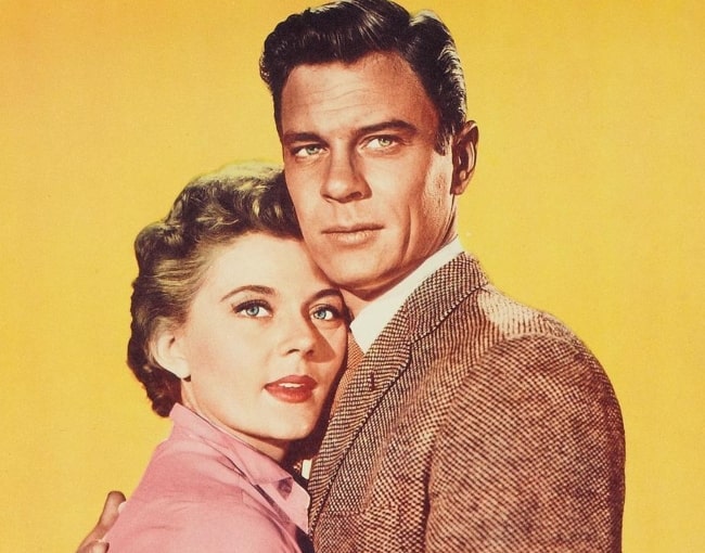 Peter Graves as seen with Peggie Castle (aka Peggy Castle) on a lobby card for the 1957 film 'Beginning of the End'