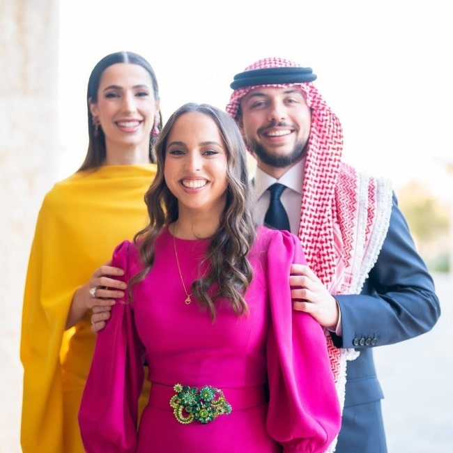 Rajwa Al Saif as seen while smiling for the camera along with Hussein, Crown Prince of Jordan and Princess Salma (Center) in March 2023