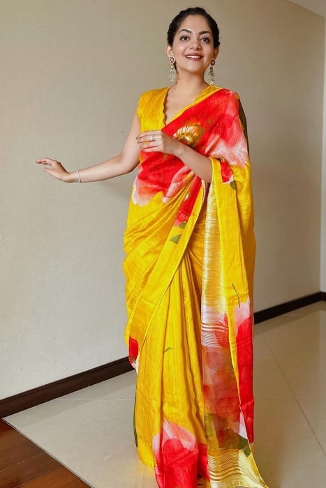Ahaana Krishna smiling for a picture while wearing a saree in Kochi, Kerala in June 2023