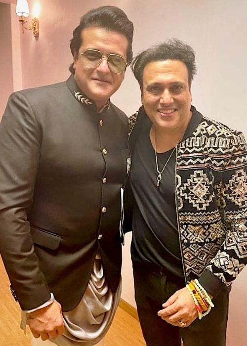 Armaan Kohli (Left) smiling for a picture along with Govinda in June 2021