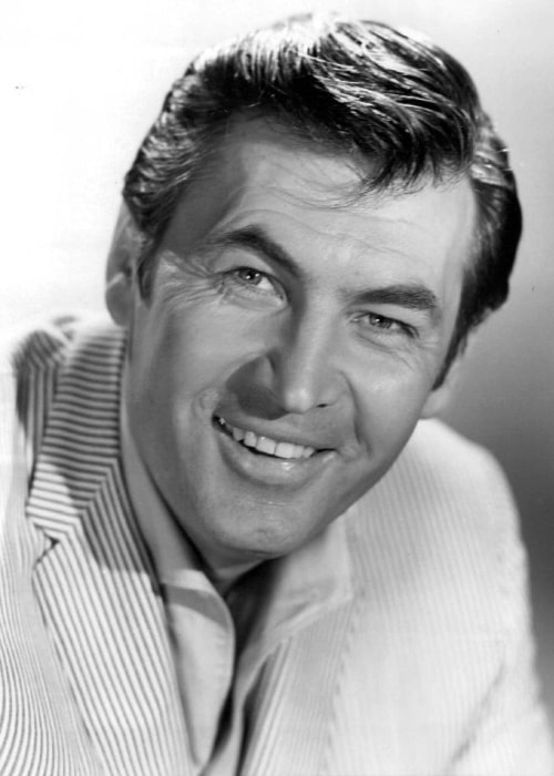 Fess Parker as seen while smiling in a still in 1968