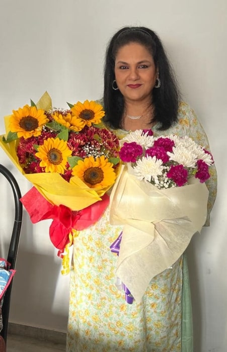 Guddi Maruti as seen while posing for the camera while holding a bouquet in April 2023