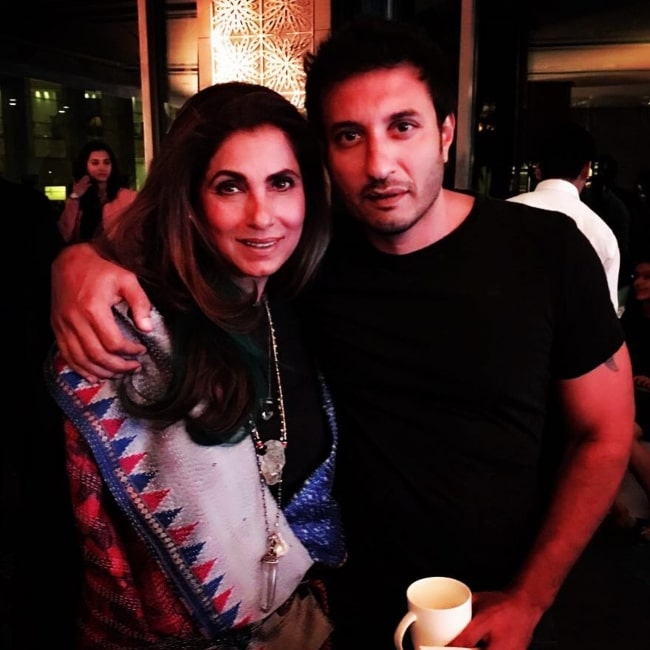 Homi Adajania and Dimple Kapadia smiling for a picture in November 2016