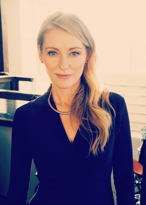 Louise Lombard smiling for a picture in August 2021