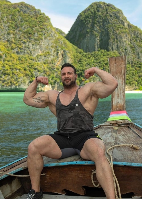 Noel Deyzel as seen in a picture flexing while on a boat that was taken in February 2023, in Phuket, Thailand