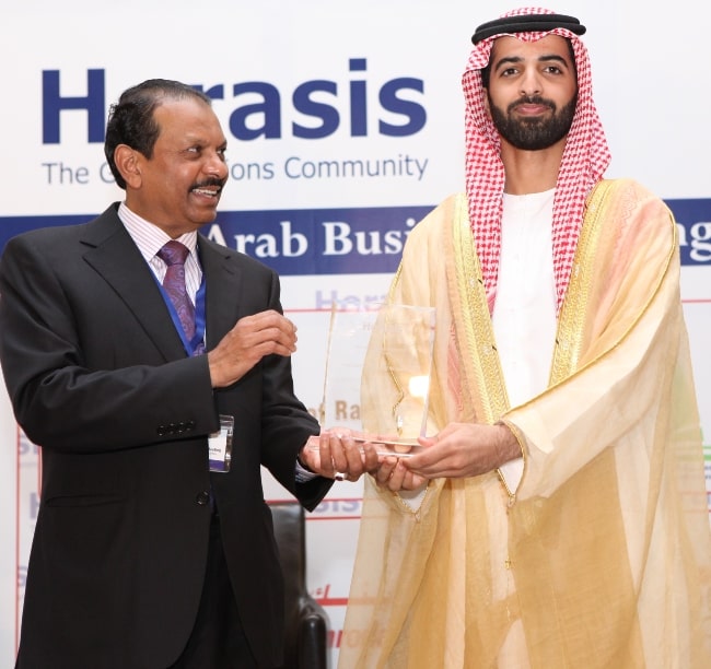 Yusuff Ali M. A. (Left) pictured while receiving an award from H.H. Mohammed bin Saud Al Qasimi at the Horasis Global Arab Business Meeting 2012