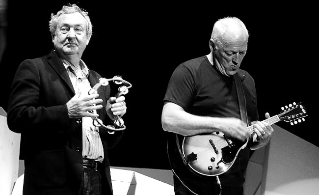 David Gilmour (Right) as seen in a black-and-white still with Pink Floyd drummer Nick Mason at Roger Waters The Wall Live show in London, England in May 2011