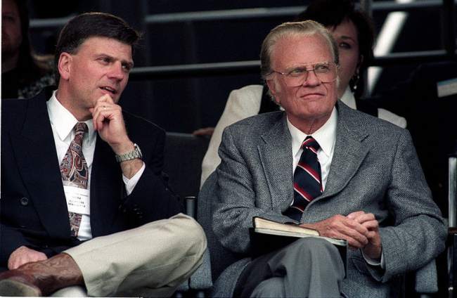 Franklin Graham as seen sitting with his father Billy Graham in Cleveland in 1994