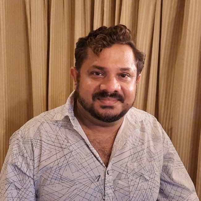 Hareesh Perumanna as seen while smiling for a picture in September 2021