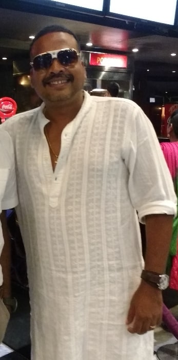John Vijay as seen while smiling for the camera at LUXE cinemas in Chennai, Tamil Nadu during the KO2 movie show