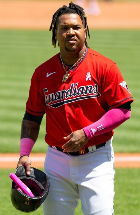 José Ramírez as seen while holding his batting helmet and walking toward the dugout at Progressive Field during a May 2023 game with the Cleveland Guardians
