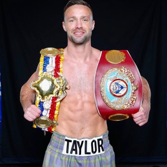 Josh Taylor as seen in a picture showcasing his championship belts in June 2023