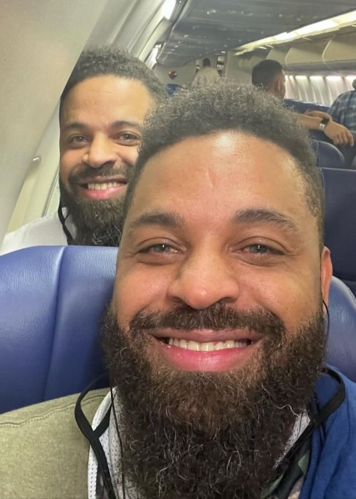 Keith Hodge as seen in a selfie with his brother Kevin (Front) while on a plane in April 2022