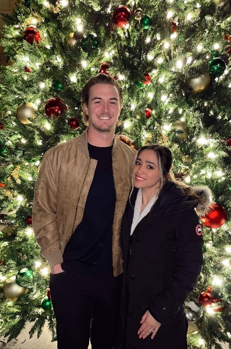 Kenny Pickett as seen while posing for a Christmas picture along with Amy Pickett in Pittsburgh, Pennsylvania in December 2022