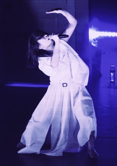 Mitski as seen while incorporating Butoh-inspired choreography in a performance in 2022