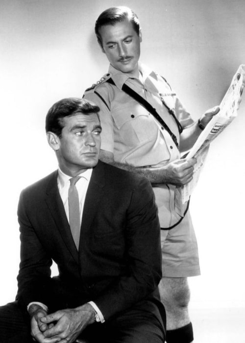 Rod Taylor (seated) as journalist Glenn Evans and Lloyd Bochner as Inspector Neil Campbell in the television series 'Hong Kong' (1961)