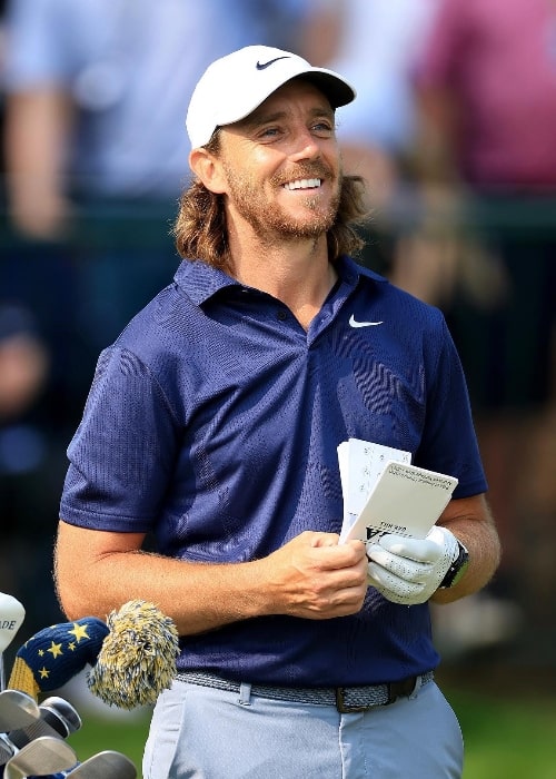 Tommy Fleetwood as seen while smiling in a still in May 2023