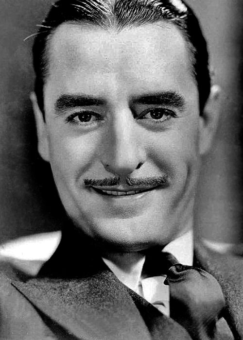 John Gilbert as seen while smiling in a publicity photo in 1931