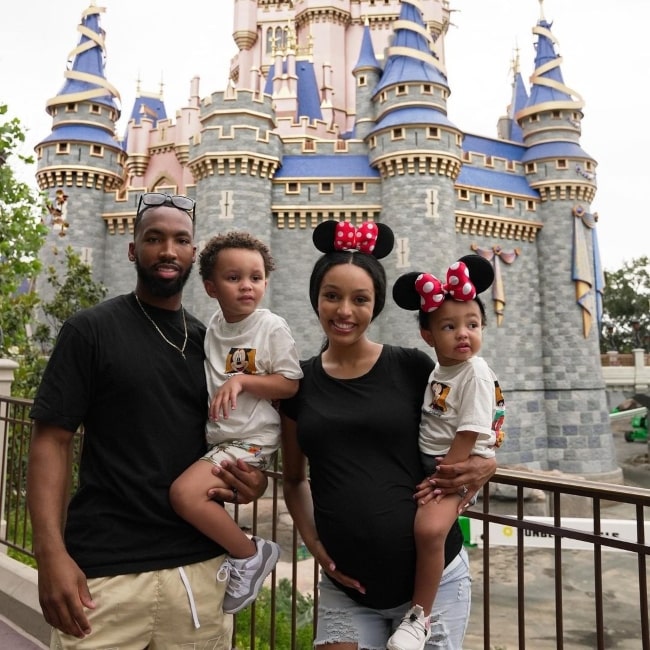 Kyra Henry as seen in a picture with her beau Tayveon and their children at Disneyland in May 2023