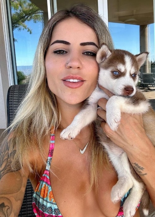 Letícia Bufoni as seen in a selfie introducing her newest pet dog in a picture taken in Los Angeles, California in August 2023