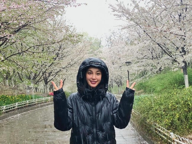 Li Bingbing as seen while posing for a picture as she enjoys snowfall in Beijing, China in April 2018