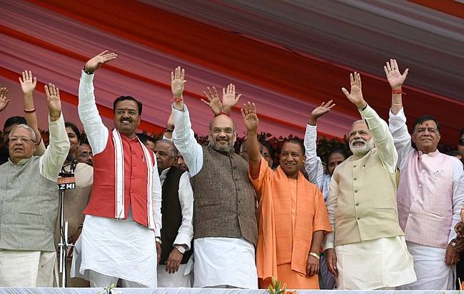 Prime Minister Narendra Modi and other Bharatiya Janata Party leaders seen at the swearing in ceremony of Yogi Adityanath in 2017