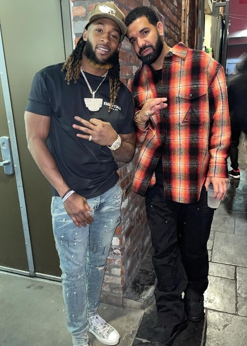 Aaron Jones (Left) as seen while posing for a picture with singer Drake in Los Angeles, California in February 2022