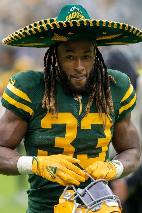 Aaron Jones with the Green Bay Packers as seen while celebrating a victory over the Washington Football Team with his signature sombrero on October 21, 2021