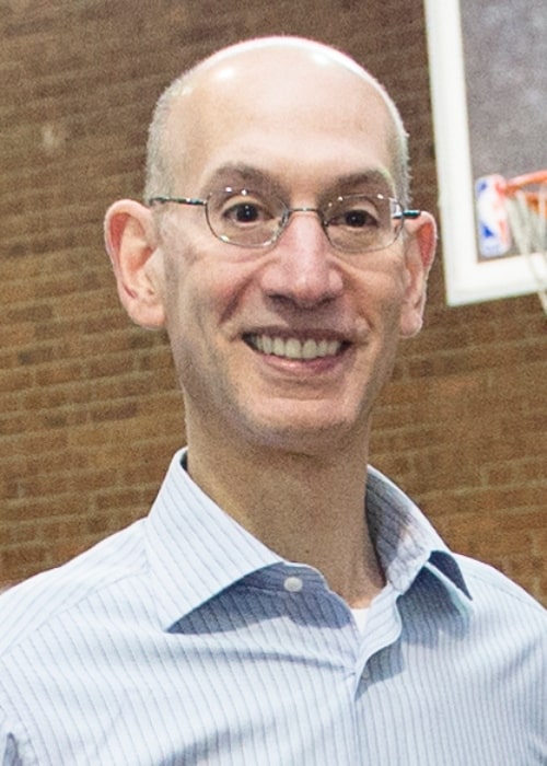 Adam Silver at a Commitment to Service event where service members and Brooklyn Nets basketball players teamed up to help distribute food at a City Harvest food bank in New York, November 6, 2014