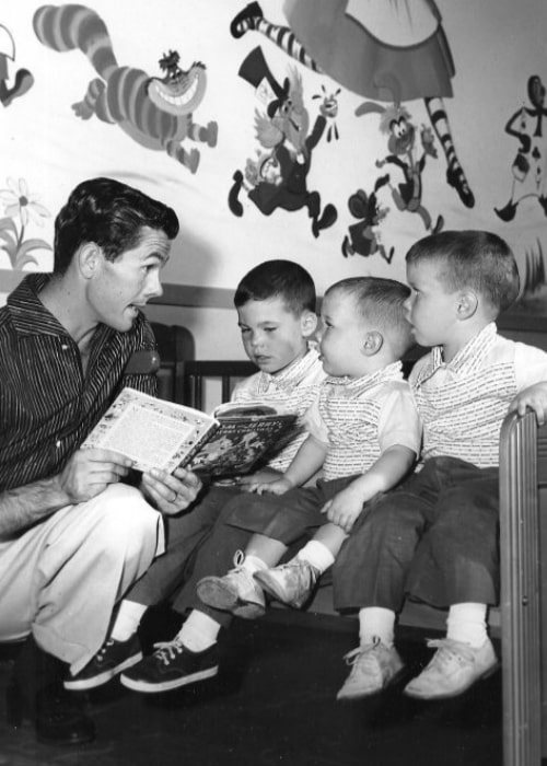 Johnny Carson as seen while reading a story with his three sons (From Left to Right - Kit, Cory, and Ricky) in 1955