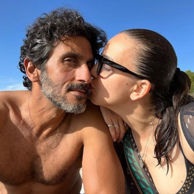 Lucy Aharish and her husband Tsahi HaLevi sharing a romantic moment that was captured in March 2023