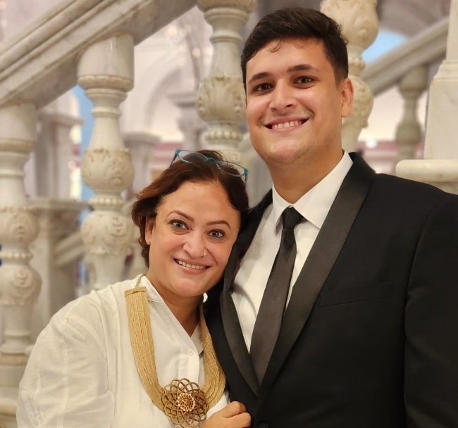 Rinku Dhawan smiling for a picture with her son in July 2023