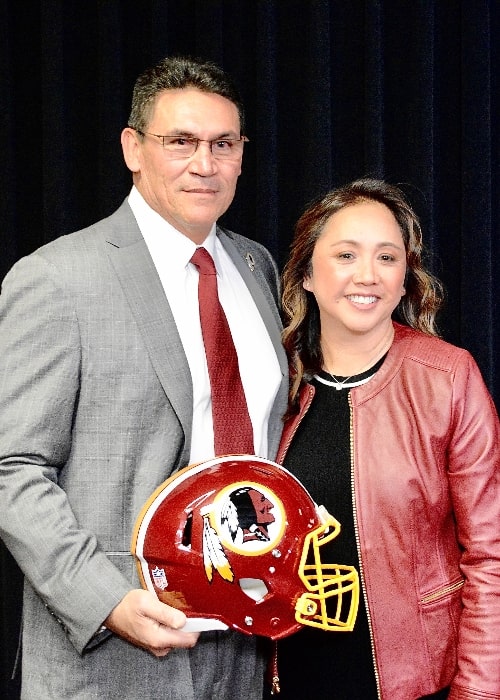 Ron Rivera as seen while posing for the camera along with his wife Stephanie at his introductory press conference as Redskins head coach in 2020