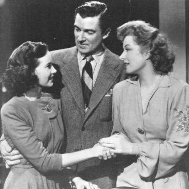 Walter Pidgeon as seen with Teresa Wright and Greer Garson in the 1942 film Mrs. Miniver